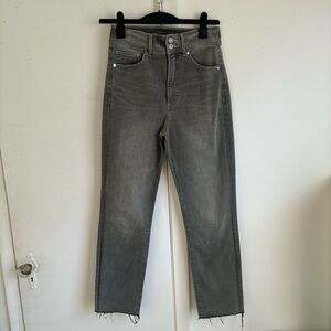 Grey straight leg jeans with raw hem